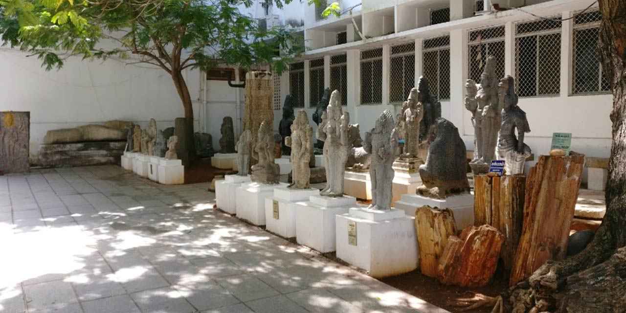 Famous Museum image where it shows Stunning statues lined up and surrounded by lush green trees