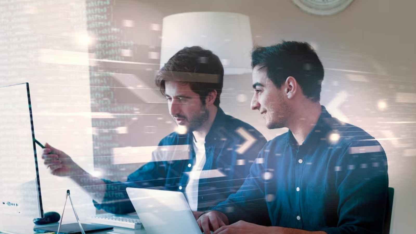 Two individuals are shown discussing their work Tech jobs